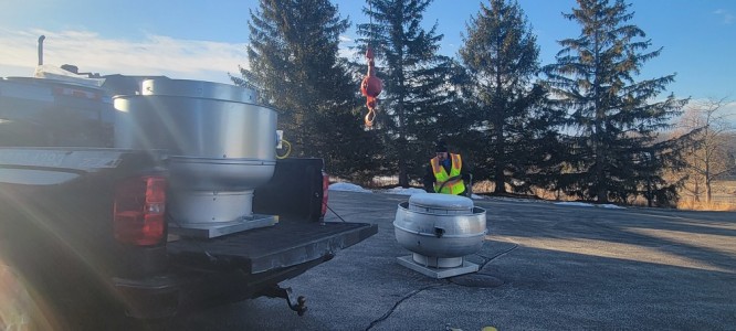Golf course commercial restaurant exhaust fan installation with crane by Elite hood