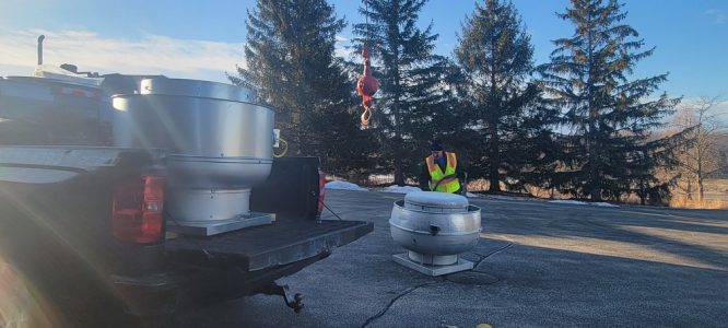 Golf course commercial restaurant exhaust fan installation with crane by Elite hood