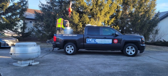 Elite Hood Cleaning Ozaukee golf course restaurant exhaust fan installation with crane